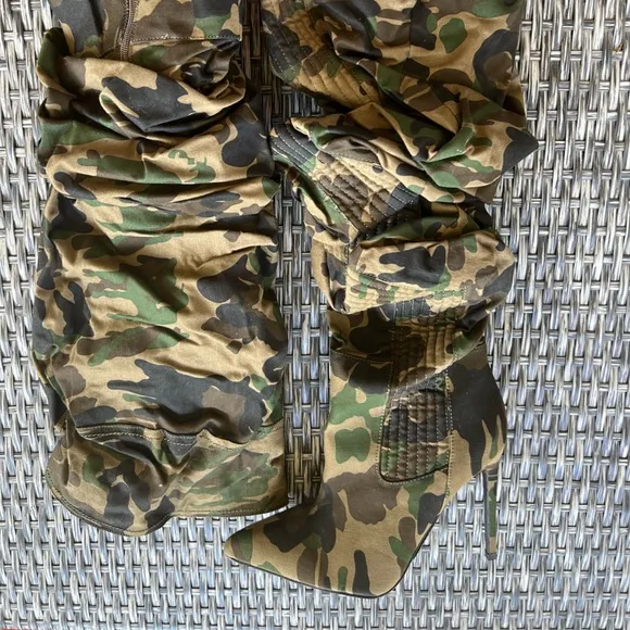 Edgy, trendy, urban camouflage slouchy, knee high boots. Strut your stuf…