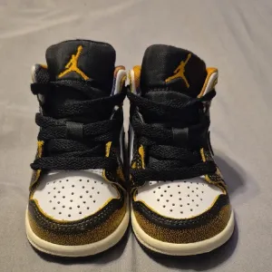 Jordan Black and Gold Classic High-Top Sneakers