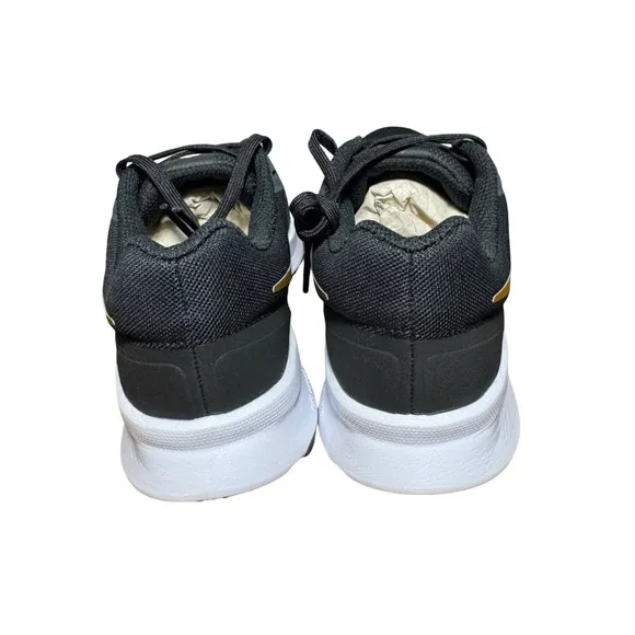 Nike women’s Black and Gold Running Shoes size 7