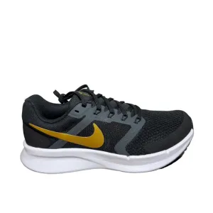Nike women’s Black and Gold Running Shoes size 7