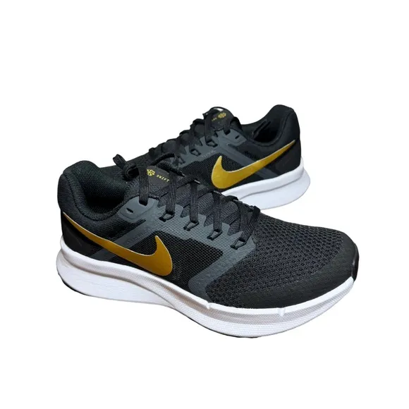 Nike women’s Black and Gold Running Shoes size 7
